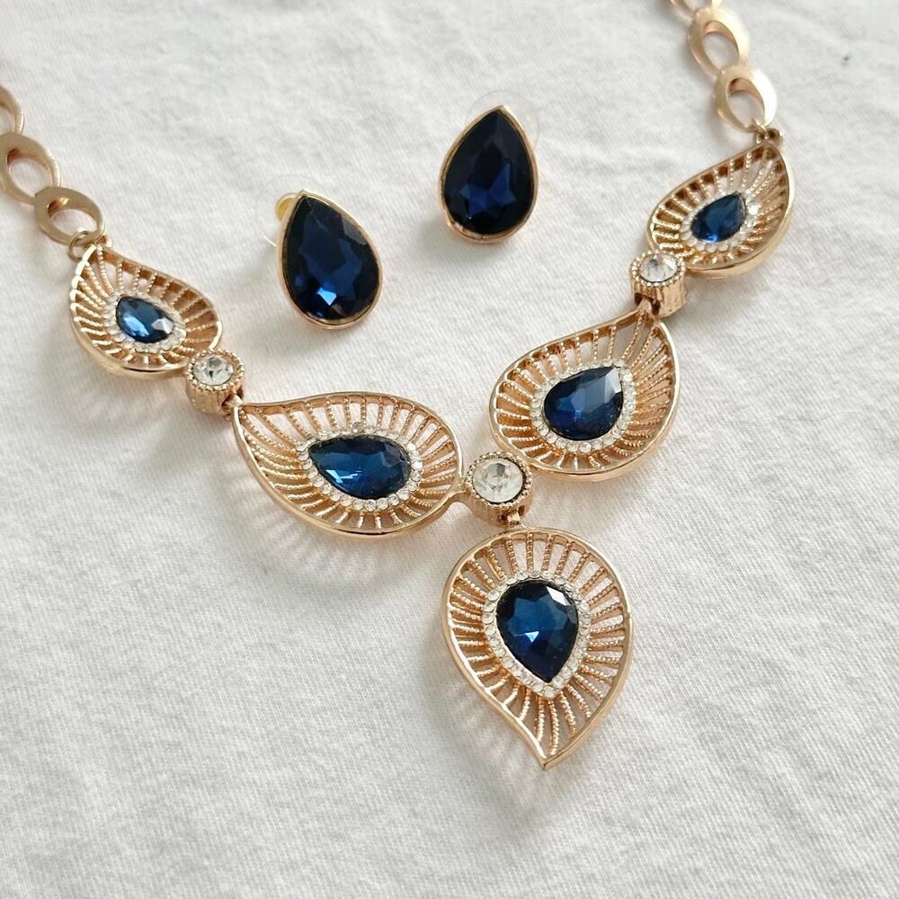 Blue gemstone teardrop gold statement necklace and earrings